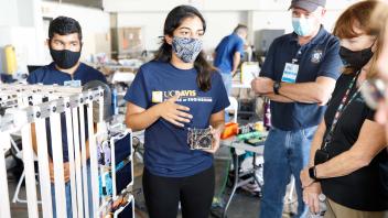 Ashna presenting CubeSat electronics during TRR