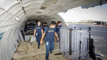 HDDs team going to pick up chamber from aircraft 
