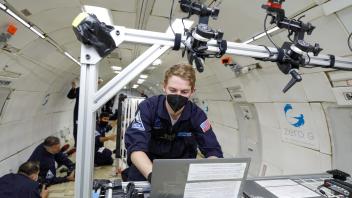 Preston working on laptop in-flight