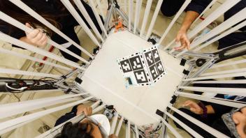 CubeSat floating in chamber 