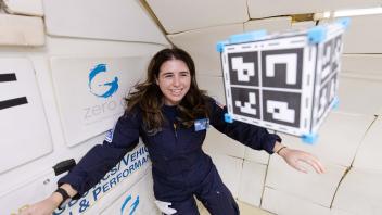 Kylie with floating CubeSat - Flight Campaign 3