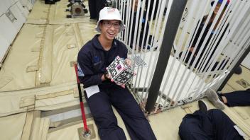 Dzuy Nguyen with CubeSat in Zero-G 