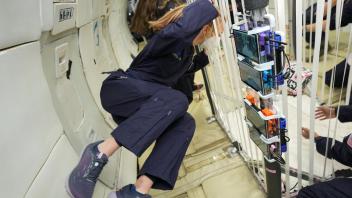 Natasha Evans floating in Zero-G
