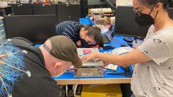Cordell and Kylie during CubeSat fit-check at JSC