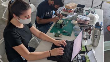 Kylie and Abhay working on hardware