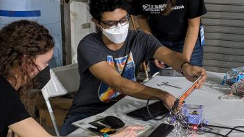 Janine, Chris, Ashna working on hardware