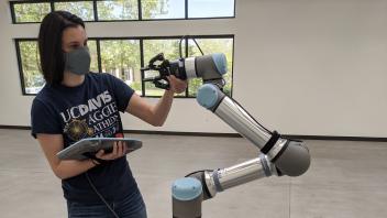 Sarah O'Meara with Robot Arm