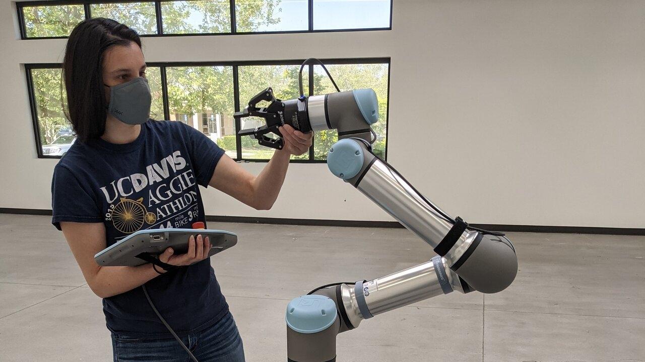 Sarah O'Meara with Robot Arm